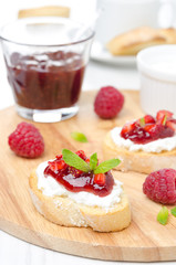 Toasted baguette with cream cheese and raspberry jam