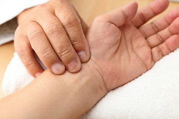 Chinese doctor diagnose pulse of patient