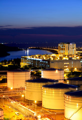 Oil tank in cargo terminal at night