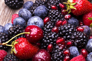 tasty summer fruits on a wooden table