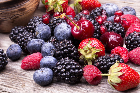 tasty summer fruits on a wooden table