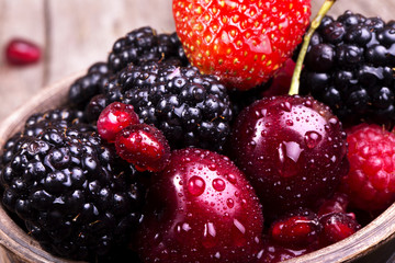 tasty summer fruits on a wooden table