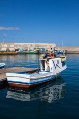 Fototapeta na wymiar Fishboat on harbor