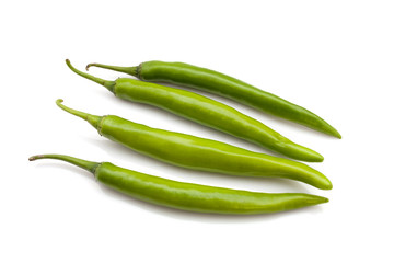 green chili peppers isolated on the white