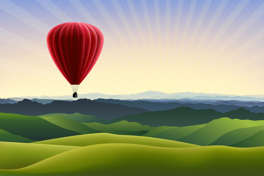 Mountain landscape with red air balloon