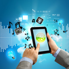 Close-up of hands holding tablet pc