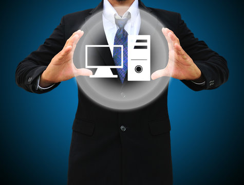 Business man holding computer icon