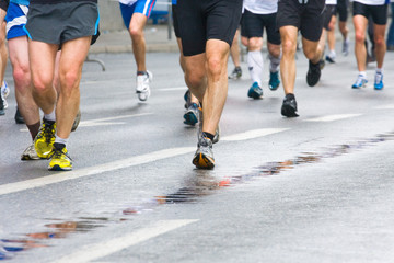 People running in city marathon