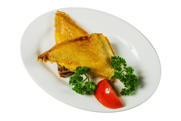 Sandwiches on a plate with tomato and herbs