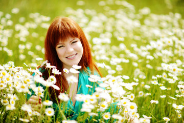 redhead  young woman in the feild