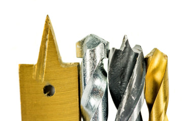 Various type of drill bits over white background