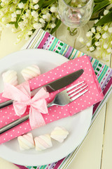 Table setting in white and pink tones