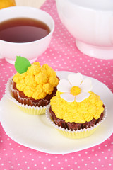 Beautiful lemon cupcakes on dining table close-up