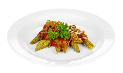 Asparagus with tasty sauce on plate, isolated on white