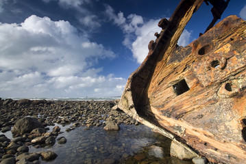 shipwreck on rocky beach, New Plymouth, New Zealand