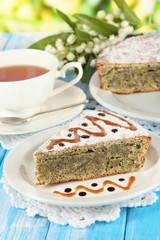Delicious poppy seed cake with cup of tea