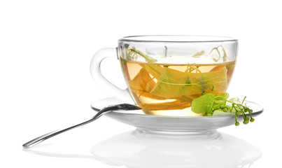 Glass cup of tea with linden isolated on white