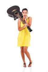 surprised young woman with a guitar