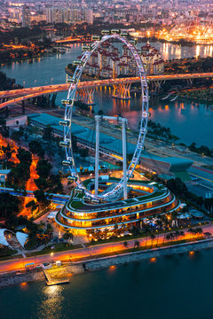 View of Singapore at night with the Singapore Flyer.