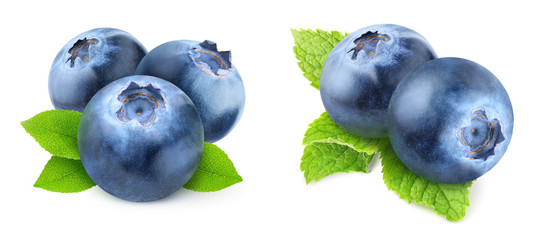 Isolated blueberries. Two images of fresh blueberry fruits with leaves isolated on white background