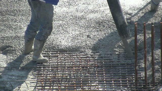poring new layer of concrete floor