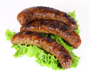 three tasty sausage with lettuce