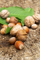 Walnuts and hazelnut on old wooden table