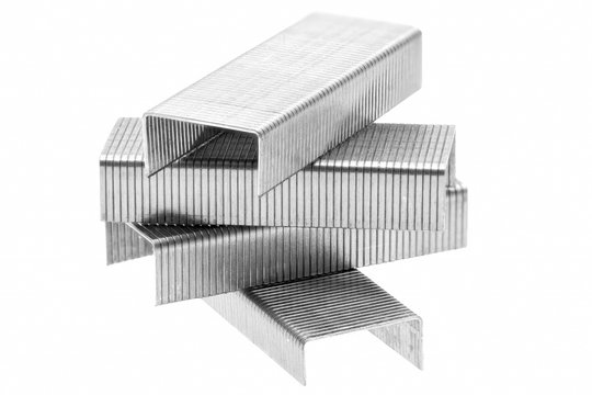 Stack of metal staples. Isolated on a white.