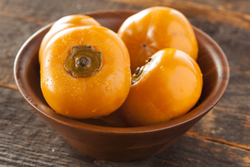 Naklejka na ściany i meble Organic Orange Persimmon Fruit