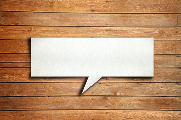 Speech ballon on wood background
