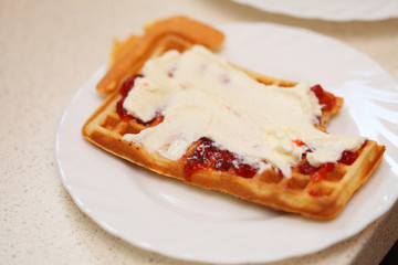 Belgian waffle with jam and whipped cream