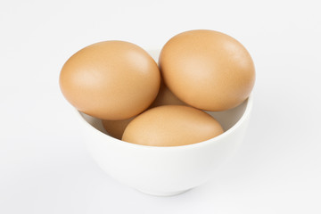 Boiled eggs in white bowl