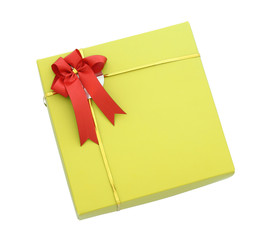 Gold gift box with red ribbon bow isolated on white with clippin