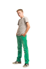 Teenager standing with hands in pockets