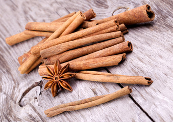 Different spices, Cinnamon, anise on wooden table