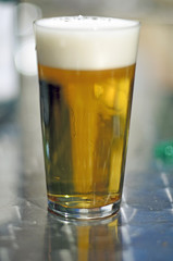 Beer glass on silver blackground