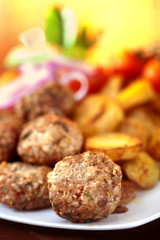 Fototapeta na wymiar meatballs served with potatoes