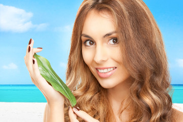 Naklejka premium woman with green leaf