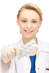 female doctor with one pack of pills