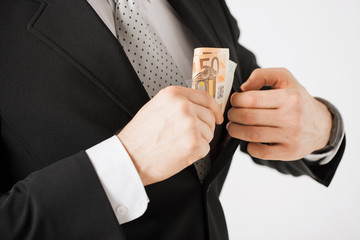 man with euro cash money
