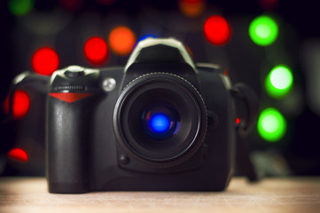 Fototapeta na wymiar DSLR Camera on blurry bokeh background