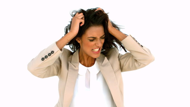 Stressed businesswoman tossing her hair