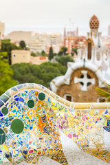 Naklejka premium Detail of colorful mosaic in a bench of park Guell, designed by