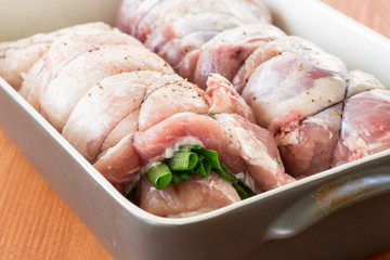 raw meat with green onions twisted to roll