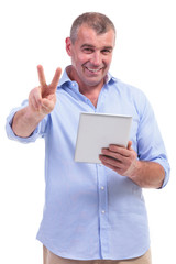 casual middle aged man shows victory sign