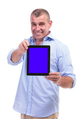 casual middle aged man shows his tablet