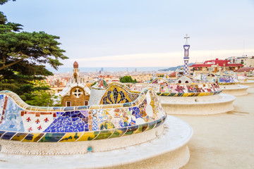 Colorful mosaic bench of park Guell, designed by Gaudi, in Barce - obrazy, fototapety, plakaty