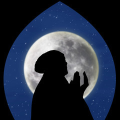 Close-up of female muslim pray on blue moon