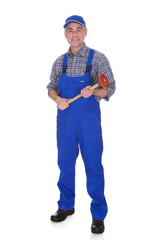 Portrait Of Male Plumber Holding Plunger