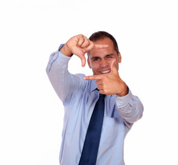 Attractive man making a frame with his hands